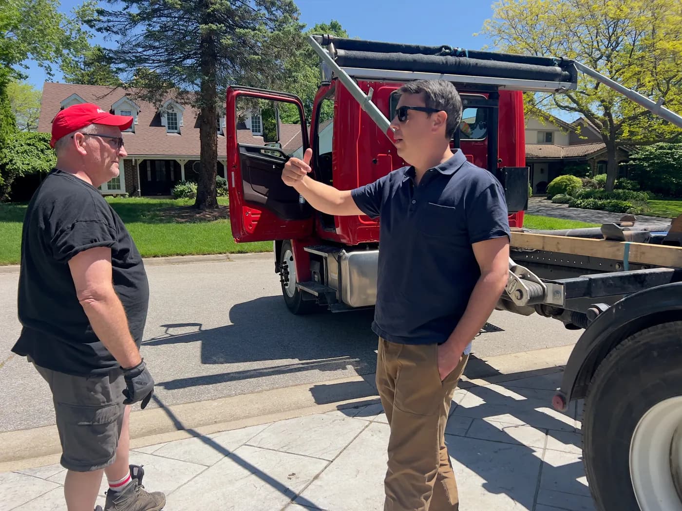 Andrew and one of the AG Disposal drivers in front of the red truck