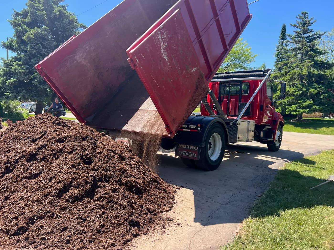Topsoil being dropped from an AG Disposal truck